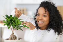 A Woman Taking Care Plants