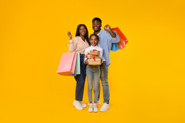 Wall Mural - Happy black people holding shopping bags and gift boxes