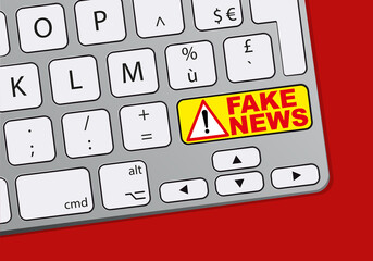 Wall Mural - Concept des fausses informations sur les réseaux sociaux avec le mot fake news écrit sur un clavier d’ordinateur.