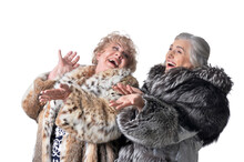 Portrait Of Senior Women In Fur Coats Isolated On White Background