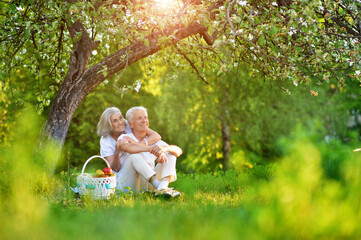 Sticker - Portrait of loving elderly couple having a picnic