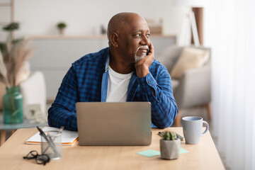 Wall Mural - Senior African American Man At Laptop Sitting Working In Office