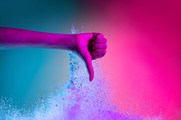 Wall Mural - Female hand and explosion of colored, neoned powder on pink blue studio background with copy space. Magazine cover, wallpaper design