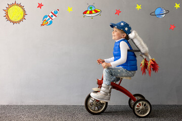 Canvas Print - Happy child playing toy rocket