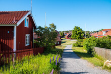 Street View In Sandham, Sweden. Village House, Garden And Footpath