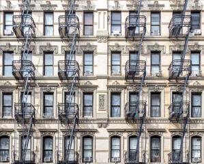 Wall Mural - Exterior view of historic apartment buildings in the Lower East Side of New York City with windows and fire escapes