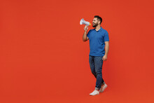 Full Body Young Smiling Happy Caucasian Man 20s Wear Basic Blue T-shirt Hold Scream In Megaphone Announces Discounts Sale Hurry Up Isolated On Plain Orange Background Studio. People Lifestyle Concept.