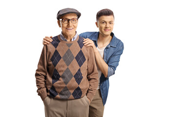 Wall Mural - Grandson standing behind his grandfather and smiling