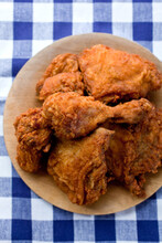 Classic Fried Chicken On A Blue Gingham Table Cloth