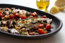 Greek Fish With Tomato, Red Onion, Olives And Parsley
