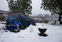 Homeless Tent On The East Bank Of The Willamette River In Portland, Oregon, On A Cold Winter Day After Snowfall.