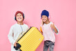 © SHOTPRIME STUDIO - cute smiling kids yellow suitcase with headphones Childhood lifestyle concept