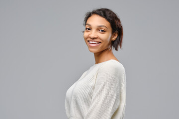 Portrait of a cheerful african woman in profile