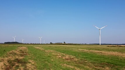 Canvas Print - Alternative renewable energy concept, windmill turbines in the field. Aerial view of rotating windmill power generator