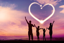 Silhouette Of Happy Family With Heart Symbol