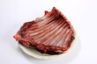 Raw deer ribs on a white plate, white background. Meat of wild animals.
Raw spare ribs on white background 