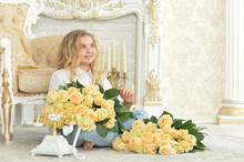 Cute Curly Teen Girl Posing With Bouquet Of Yellow Roses