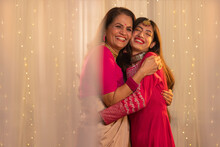 Portrait Of Indian Mother And Daughter Hugging Each Other On Occasion