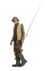 Wall Mural - Portrait of young man, professional fishman with fishing rod, spinning and equipment going to river isolated over white studio background