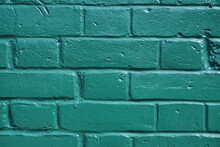 Brick Wall Background. Green Painted Wall Surface. Textured Wallpaper.