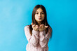 © F8  \ Suport Ukraine - Portrait of attractive caucasian little girl over blue background sending air kiss