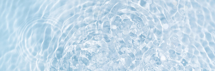 Banner of watery blue and clean surface with ripple effect and circles from drops, top view. Perfect transparent background.