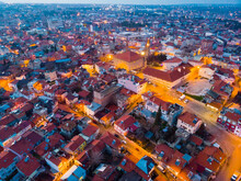 View From Drone Of Residential Districts Of Turkish City Of Burdur Overlooking Lighted Streets And Great Mosque On Winter Evening
