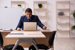 © Elnur - Young male employer in front of white board