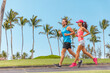 © Maridav - Sport fitness runners couple running lifestyle. Healthy people jogging together in summer city park outdoor, athletes training cardio on sidewalk.