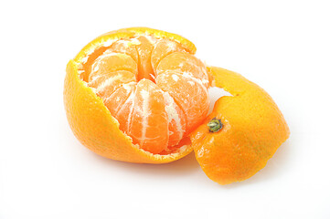 Wall Mural - tangerine with peeled peel on a wooden background