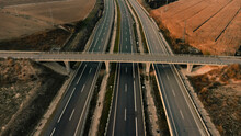 Empty Bridge Over Highway Passing By Agricultural Field In Lleida, Spain