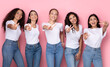 © Prostock-studio - Successful Multiracial Women Gesturing Victory Sign Over Pink Studio Background