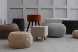 Fototapeta  - Different stylish poufs and ottomans in room