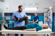 © DC Studio - Chiropractor stretching leg muscle to relieve pressure for recovery of retired woman. Medical nurse helping aged patient with knee pain, doing physical exercise for orthopedic care