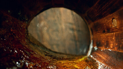 Wall Mural - Freeze motion of splashing whisky in barrel