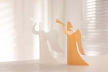 Beautiful Angel Paper Cutouts On White Table Indoors