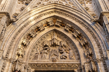 Wall Mural - Sevilla, Spain. The Puerta de San Miguel (St Michael's Gate) of the Gothic Cathedral of Saint Mary of the See