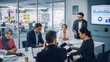 © Gorodenkoff - Diverse Modern Office: Businessman Leads Business Meeting with Managers, Talks, uses Presentation TV with Statistics, Infographics. Digital Entrepreneurs Work on e-Commerce Project.