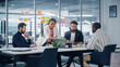 © Gorodenkoff - Diverse Modern Office: Successful Motivated Black Businesswoman Leads Meeting, talks of Company Growth. Digital Entrepreneurs Work on e-Commerce Project. Multi-Ethnic People Brainstorming.
