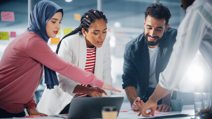 Wall Mural - Multi-Ethnic Office Conference Room Businesspeople Meeting at Big Table. Diverse Team of Creative Entrepreneurs Talk, Find Solution. Specialists work in Digital e-Commerce Startup.