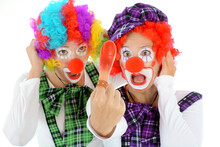 Two Clowns With Red Nose, Costume And Wig Are Silly And Funny