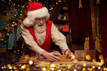 Poster - hardworking santa makes toys