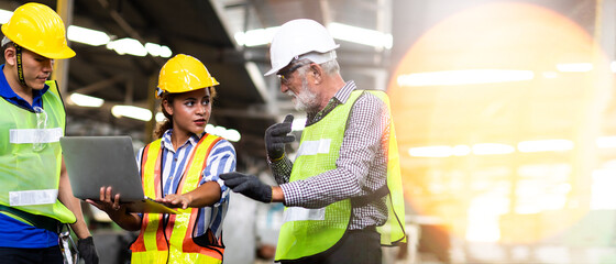 Wall Mural - Professional Mechanical Engineer team Working on Personal Computer at Metal lathe industrial manufacturing factory. Engineer Operating  lathe Machinery. Product quality Inspection