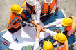 © NVB Stocker - Ethnic diversity worker people, Success teamwork. Group of professional engineering people wearing hardhat safety helmet meeting with solar photovoltaic panels discussion in new project