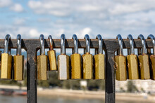 Close Up Photography Of Love Locks Hanged On Old Town Bridge. Various Size And Colors Of Locks On Metal Fence. 