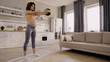 © LIGHTFIELD STUDIOS - Curly pregnant sportswoman exercising with slam ball on fitness mat at home