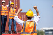 © NVB Stocker - Strike of workers in container yard. Group of multiethnic engineer people during a protest in workplace
