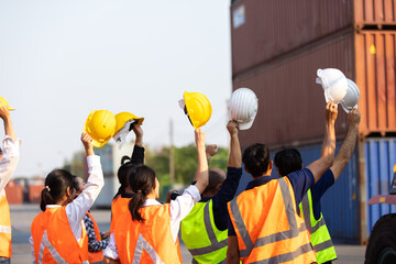 Strike of workers in container yard. Group of multiethnic engineer people during a protest in workplace