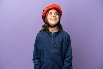 Wall Mural - Little caucasian girl isolated on purple background laughing