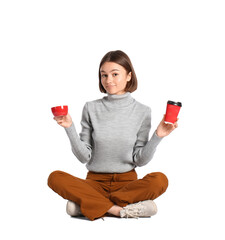 Wall Mural - Beautiful woman with cups of coffee on white background